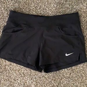 Nike shorts with spandex & pockets.